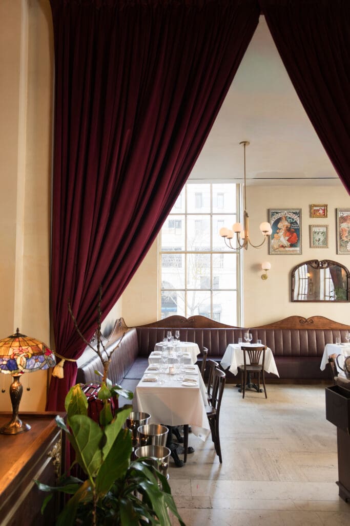 Elegant dining room at La Grande Boucherie in Washington DC for rehearsal dinners and wedding receptions