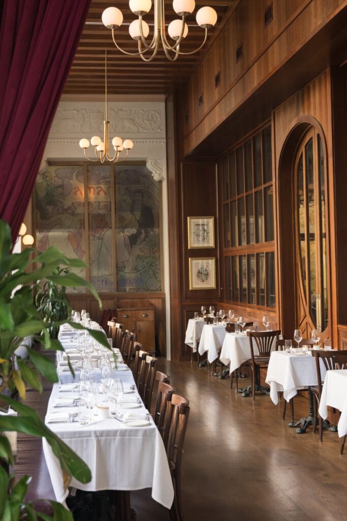 Interior of La Grande Boucherie restaurant wedding venue in Washington DC with art nouveau ceiling and skylight