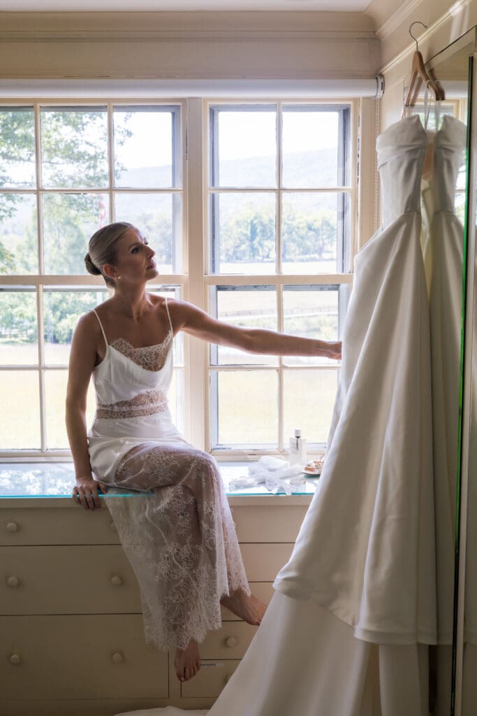 bride getting ready at private estate near Middleburg Virginia with natural window light