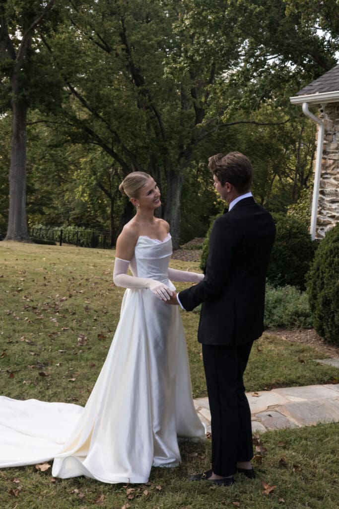 bride and groom first look by stone cottage at Middleburg Virginia wedding venue