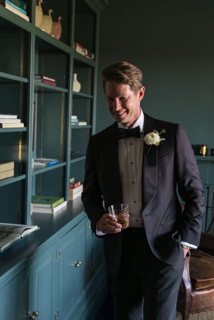 classic groom portrait in moody interior inspired by Ralph Lauren style