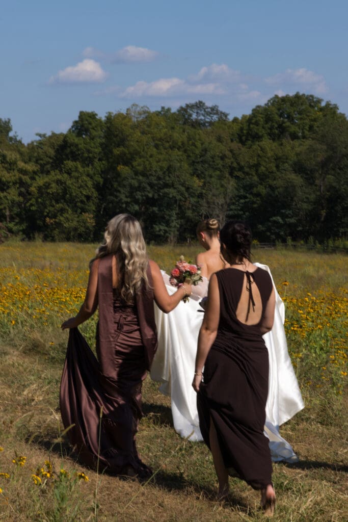 wedding party portraits in marigold field at Virginia countryside estat