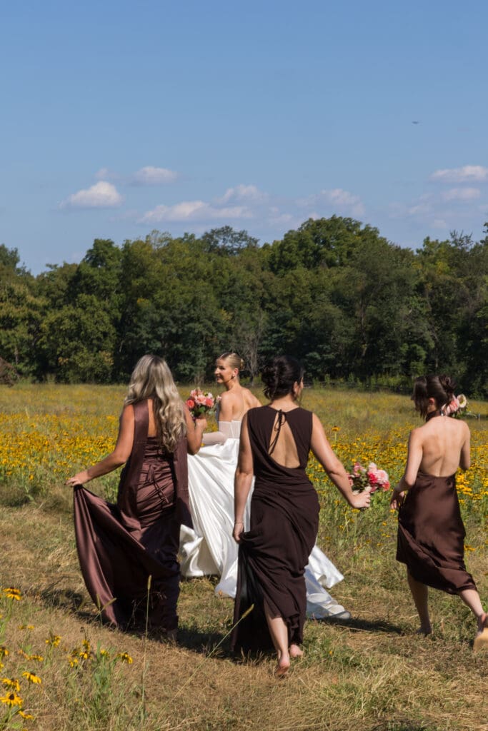 wedding party portraits in marigold field at Virginia countryside estat
