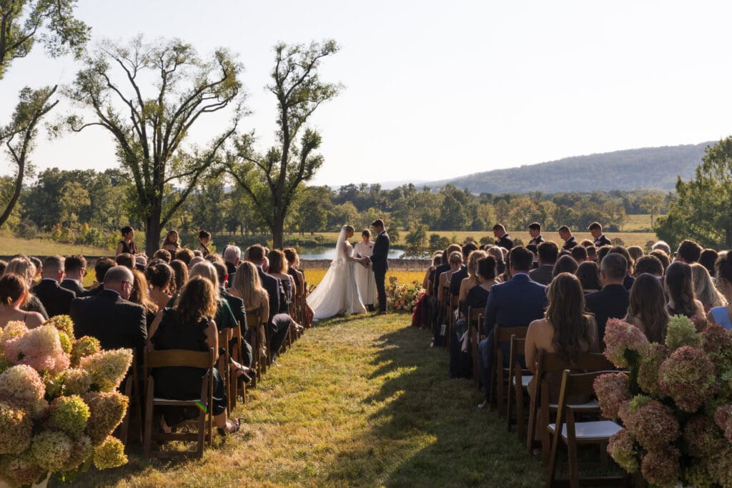 outdoor wedding ceremony under tall trees at private estate near Middleburg VA