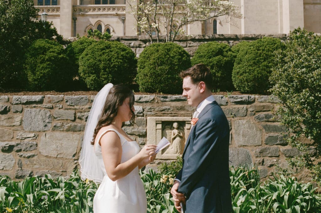 Couple exchanging private vows in the Bishop’s Garden at the Washington National Cathedral