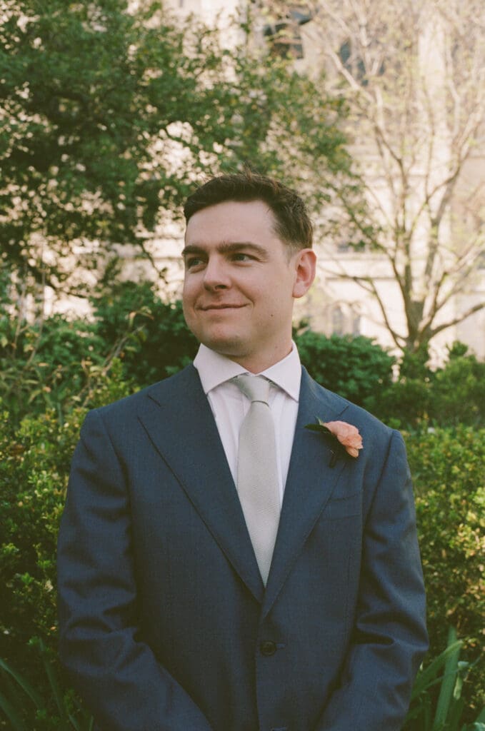 Groom waiting in Bishop’s Garden before first look at the National Cathedral
