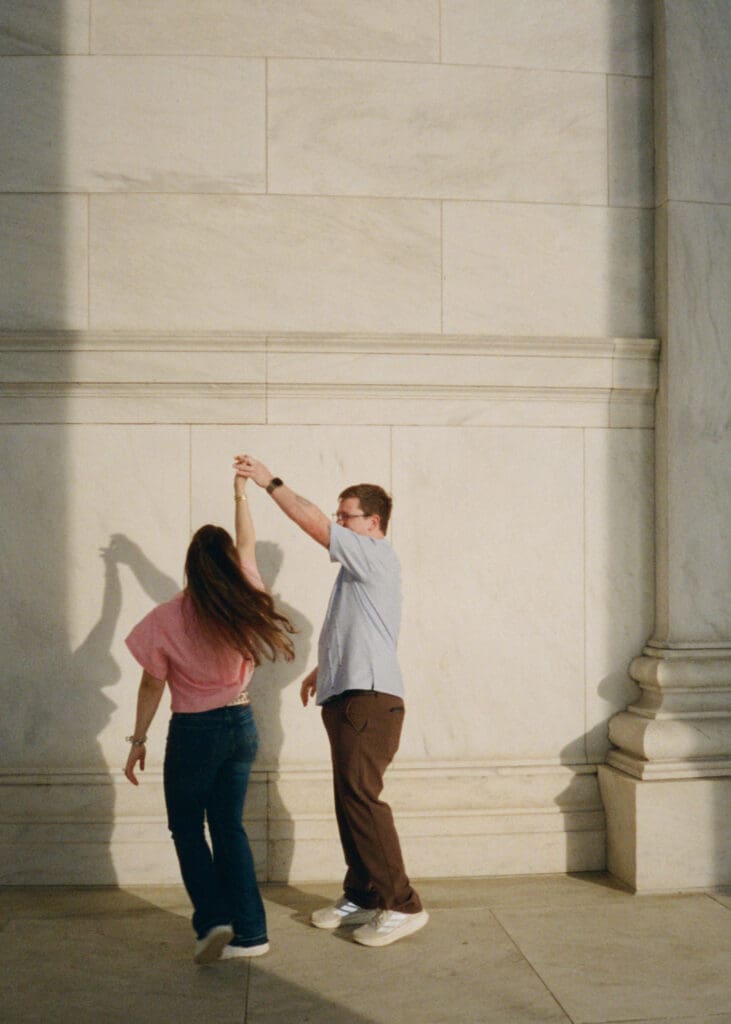 Sunrise engagement photos at the Jefferson Memorial during cherry blossom season