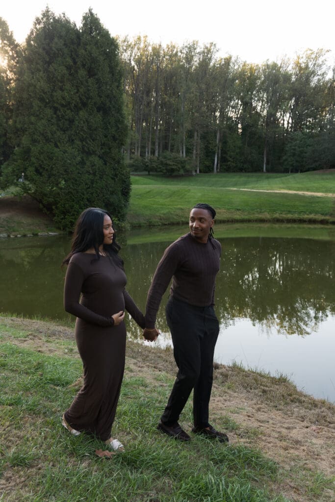 Couple holding hands in the flower gardens at Brookside Gardens