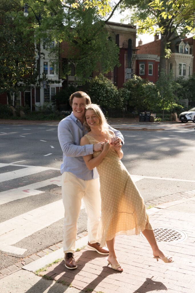 Couple walking through historic streets in Capitol Hill during engagement session