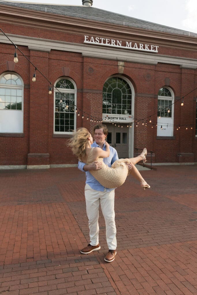Couple walking through historic streets in Capitol Hill during engagement session