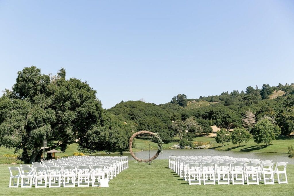 Elegant outdoor wedding ceremony at Quail Lodge surrounded by greenery