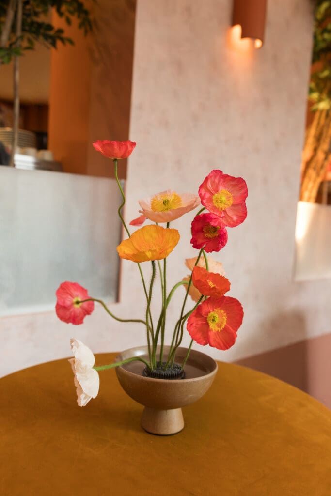 Bright floral centerpiece designed for a wedding industry event at River Club DC.