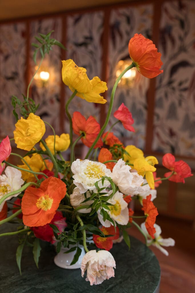 Bright floral centerpiece designed for a wedding industry event at River Club DC.
