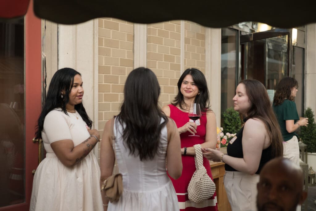 Event attendees enjoying conversation and cocktails during a Washington, DC vendor networking event.