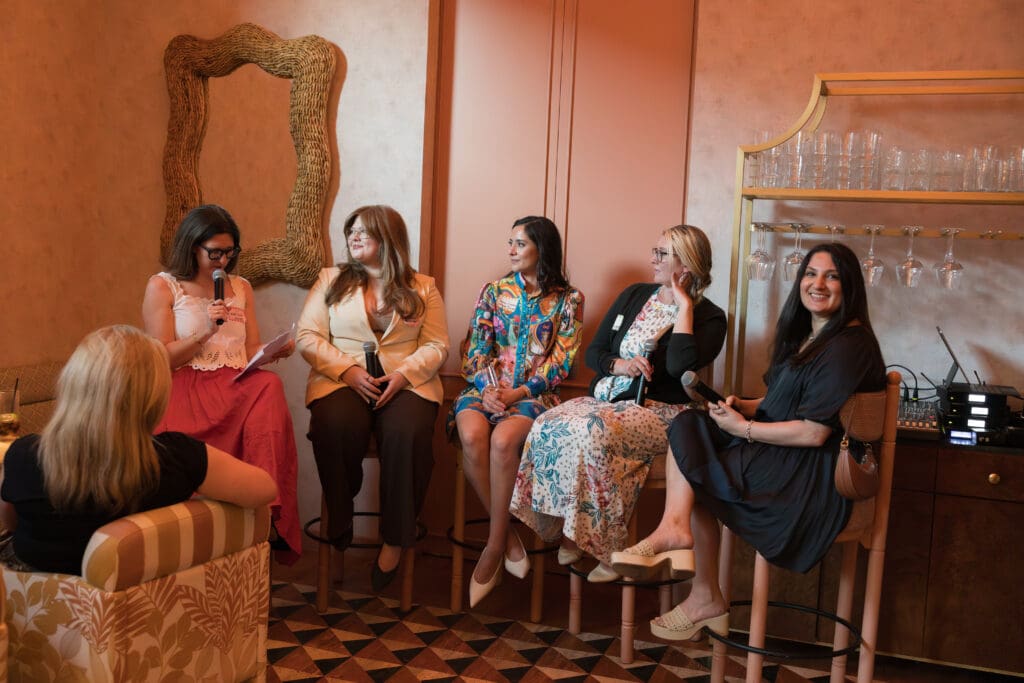 Industry experts discussing authenticity, AI, and the future of the wedding industry during a panel discussion.